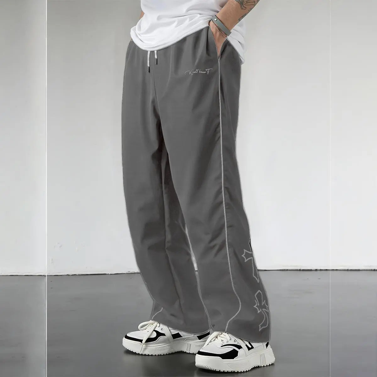 Elevate Your Style with Men's Summer Loose Sports Pants - Lightweight, Comfortable, and Stylish Gray Trousers with Gold Accents