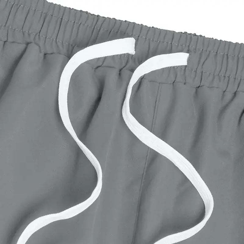 Elevate Your Style with Men's Summer Loose Sports Pants - Lightweight, Comfortable, and Stylish Gray Trousers with Gold Accents